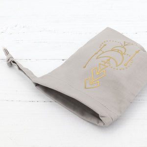 Cotton crystal pouch with a gold geometric vinyl detail